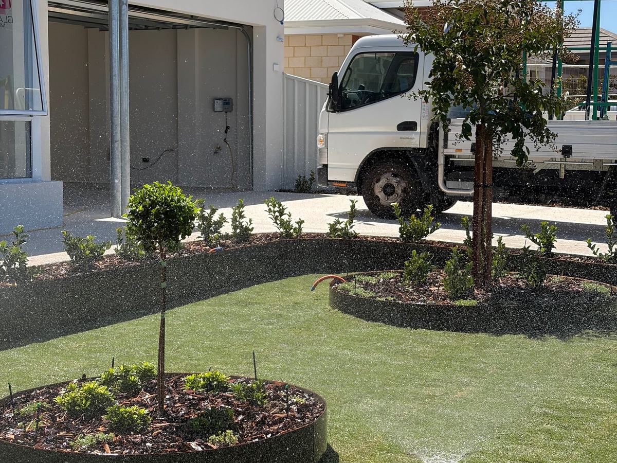 Reticulation running over a new front lawn